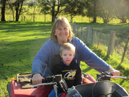 My grandson and me on the farm bike